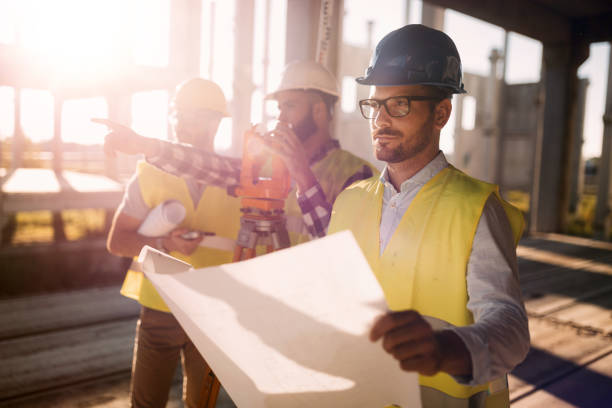 Picture of construction engineer working on building site Picture of male construction engineer working on building site land planning stock pictures, royalty-free photos & images