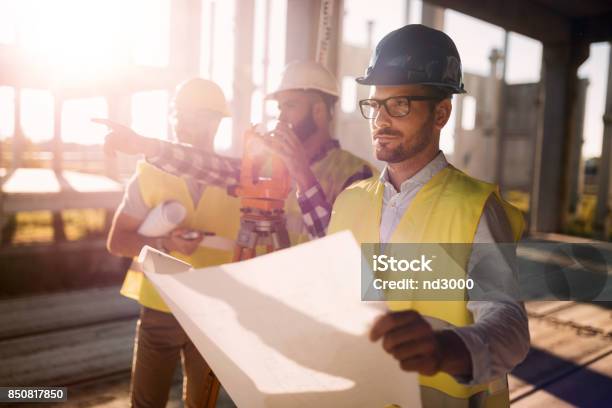 Picture Of Construction Engineer Working On Building Site Stock Photo - Download Image Now