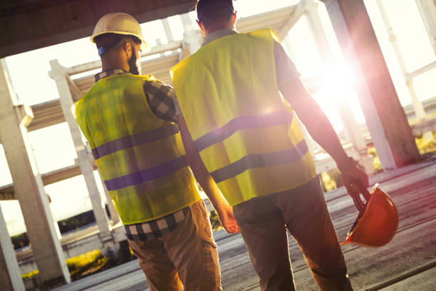 istock Portrait of construction engineers working on building site 850819916