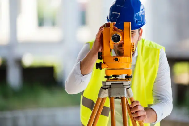 Picture of male construction engineer working on building site