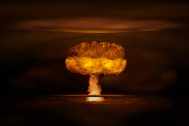 Atomic bomb realistic explosion, orange color with smoke on black background