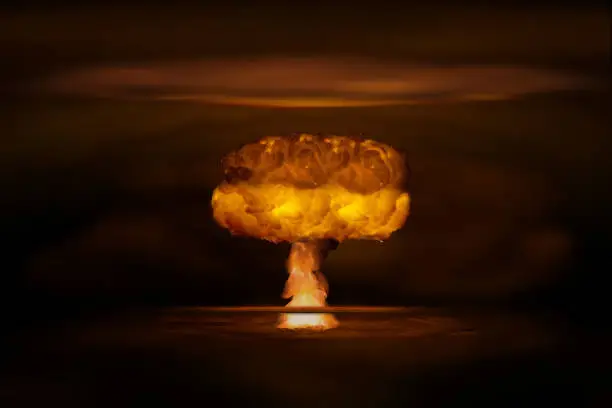 Atomic bomb realistic explosion, orange color with smoke on black background