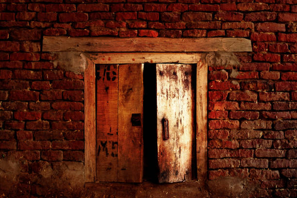 The broken hole in the wall of abandoned house.