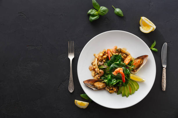 istock Warm salad with grilled seafood flat lay 850829046