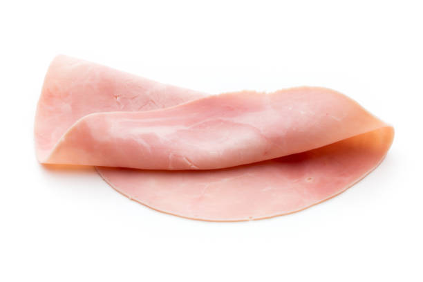 istock Sliced boiled ham sausage isolated on white background, top view. 850832334