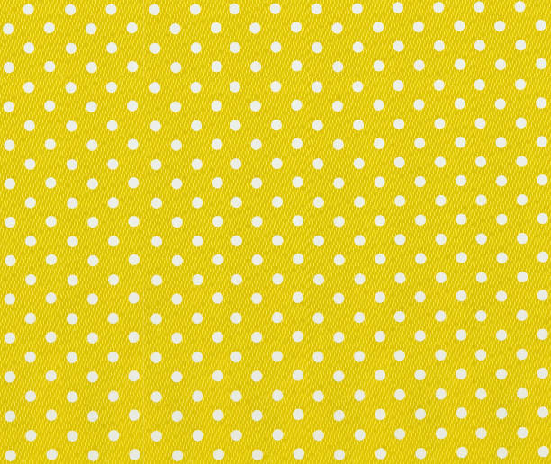 istock yellow fabric with white polka dots 850832762