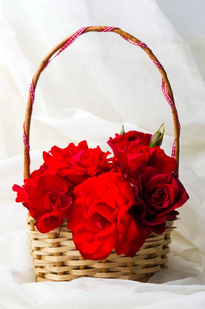 istock Red roses bouquet in a wciker basket 850838242