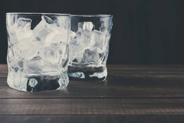 istock Glasses with ice cubes on dark background 850841038