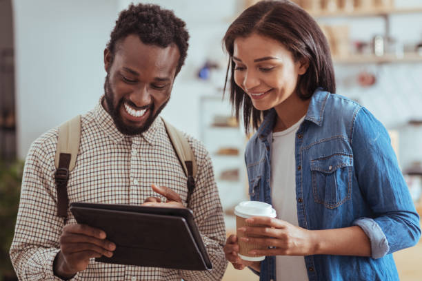 istock Upbeat friends checking cafe menu on tablet 850841636