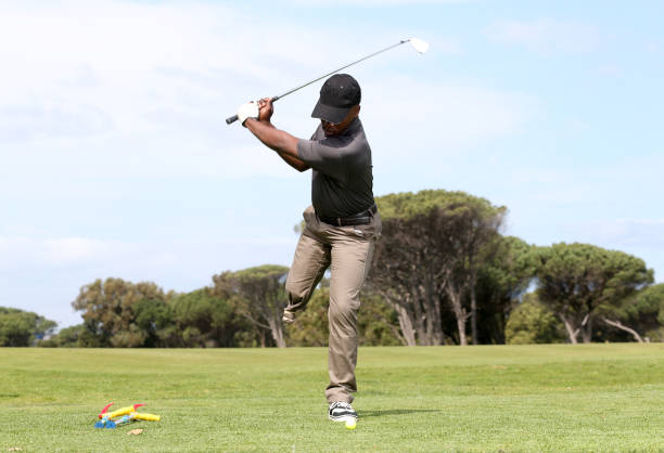 istock A young black man with only one leg playing golf 850845934