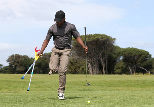 istock A young black man with only one leg playing golf 850845938