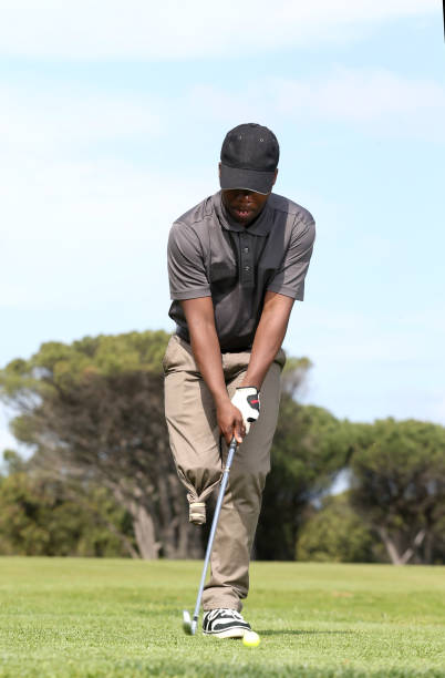 istock A young black man with only one leg playing golf 850846096