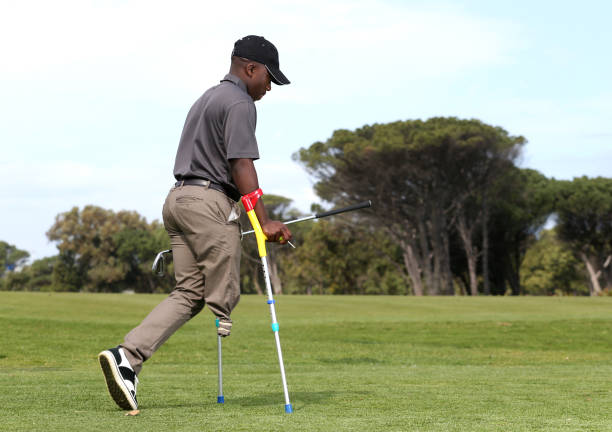 istock A young black man with only one leg playing golf 850846116