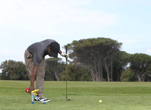istock A young black man with only one leg playing golf 850846244