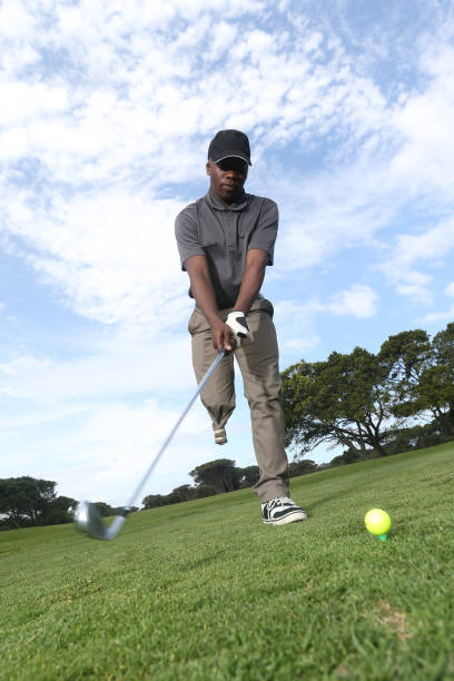 istock A young black man with only one leg playing golf 850846452