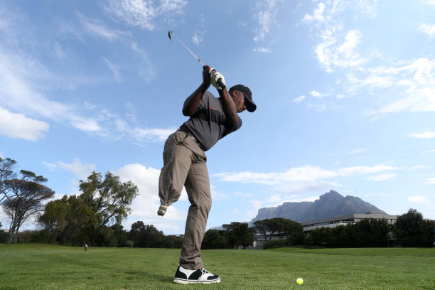istock A young black man with only one leg playing golf 850846918