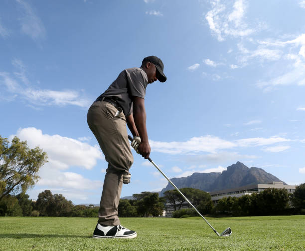 istock A young black man with only one leg playing golf 850847064