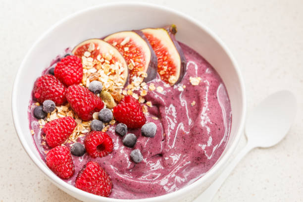 istock Smoothie bowl (blueberry, acai) with figs, raspberries and granola. 850847458