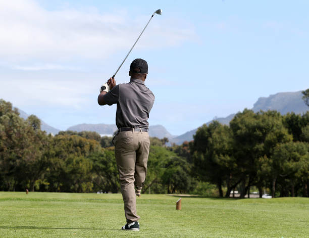 istock A young black man with only one leg playing golf 850849628