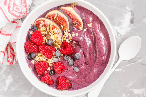 istock Smoothie bowl (blueberry, acai) with figs, raspberries and granola. 850851822