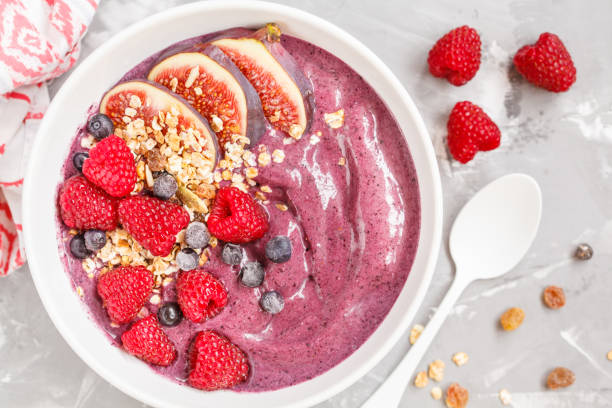 istock Smoothie bowl (blueberry, acai) with figs, raspberries and granola. 850852184