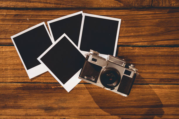 istock Instant photos on wooden floor 850853462