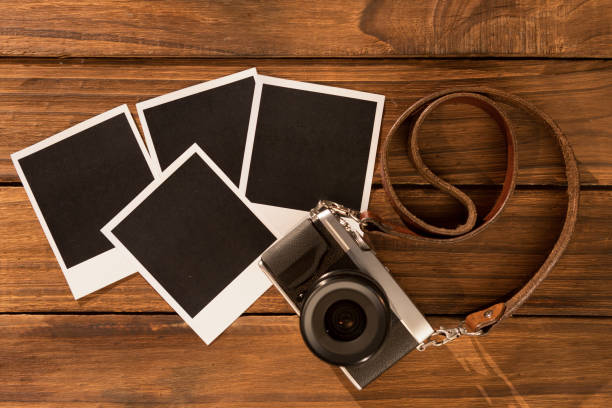 istock Instant photos on wooden floor 850853622