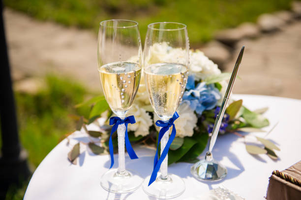 istock Stylish wedding glasses with champagne standing on the table 850854554
