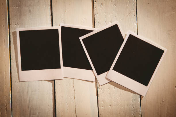 istock Instant photos on wooden floor 850854662