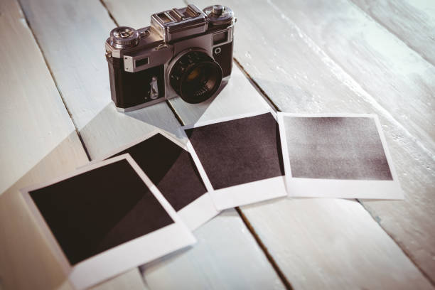 istock Instant photos on wooden floor 850854694