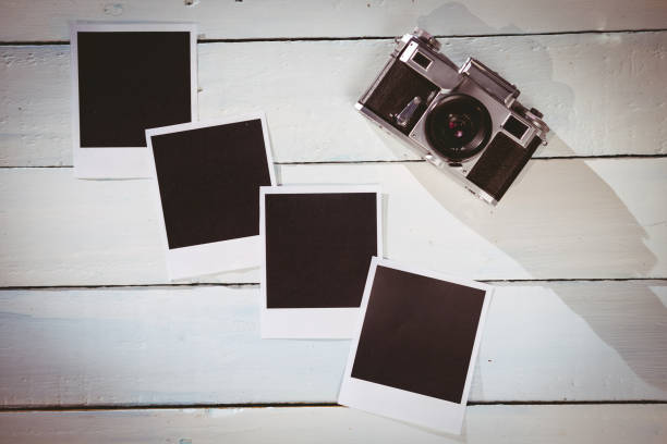 istock Instant photos on wooden floor 850854816