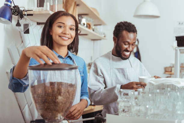 istock Cheerful new baristas training their coffee-making art 850857900