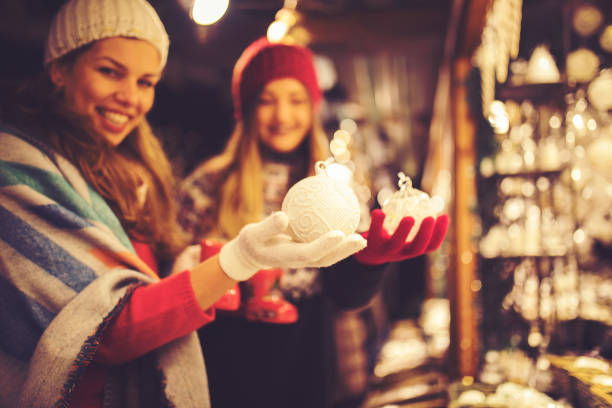 Girl friends having fun and enjoying on Christmas market