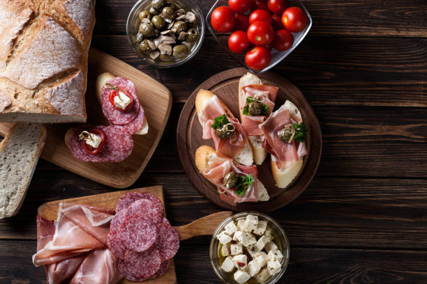 istock Spanish tapas with slices jamon serrano, salami, olives and chee 850875684