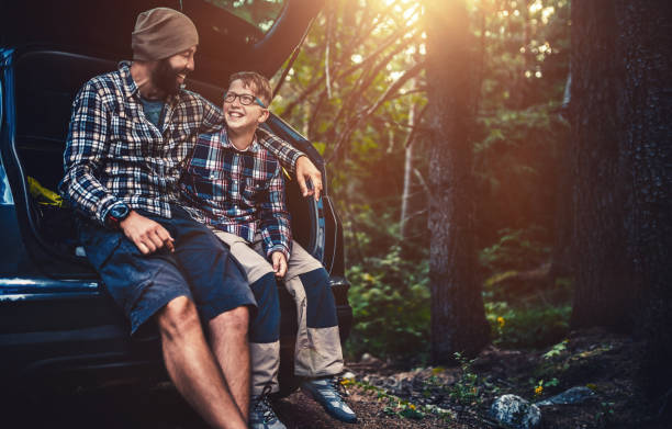istock Father and son travelling by car 850876462