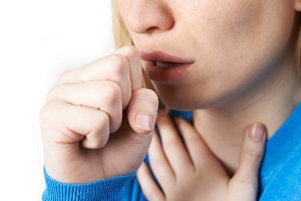 Close Up Of Woman Suffering With Cough stock photo