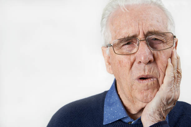 istock Studio Portrait Of Senior Man Suffering With Toothache 850880154