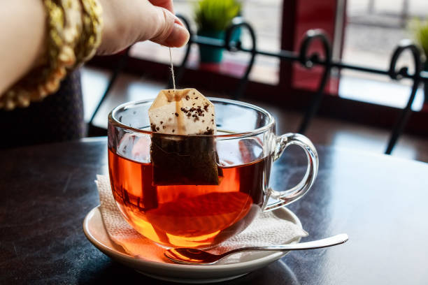 istock Tea bag put in transparent glass teacup 850880552