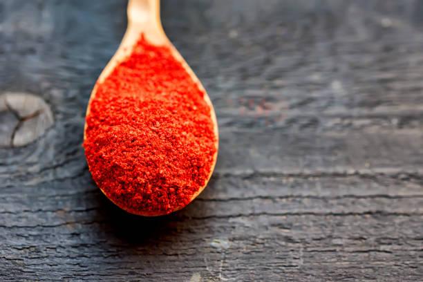 istock Close up wooden spoon with paprika spoon 850884132
