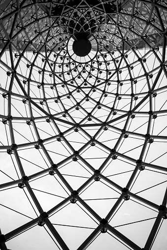Abstract architecture curved steel beam glass roof in black and white of Sathorn Square building, Bang Rak, Bangkok, Thailand