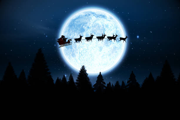 santa volant sur ciel nocturne - père noel ciel photos et images de collection