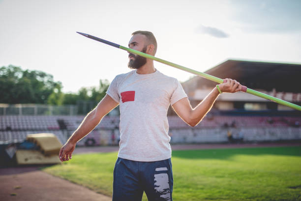 istock Athletic man preparing to throw a javelin 850894980