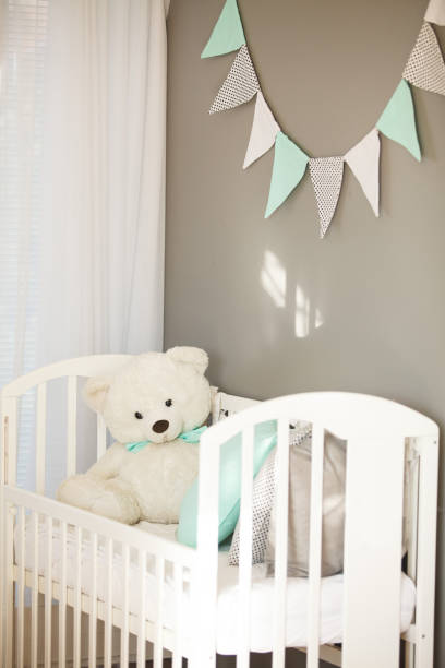 istock White crib in baby's room 850905630
