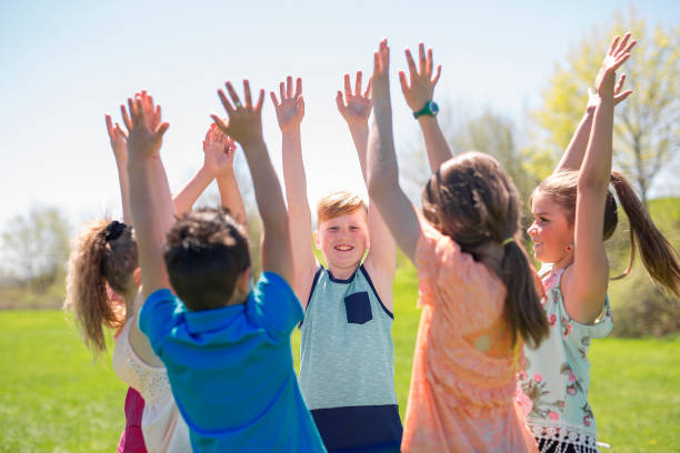 istock Group of child have fun on a field hand high 850905822