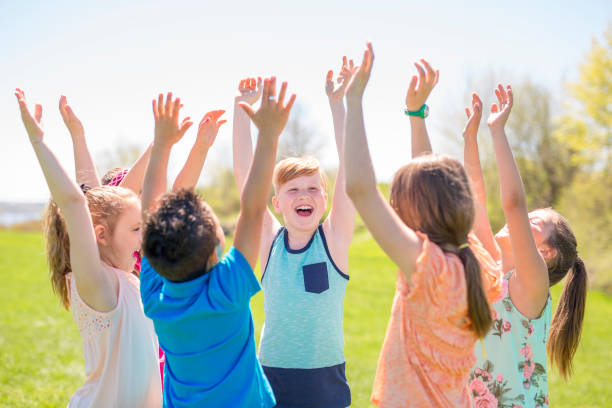 istock Group of child have fun on a field hand high 850906420