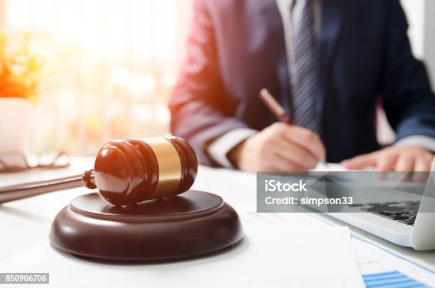 Wooden Gavel On Table Attorney Working In Courtroom Stock Photo - Download Image Now