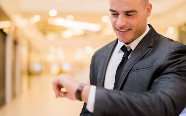 istock Young businessman always keeps his time in check 850910876