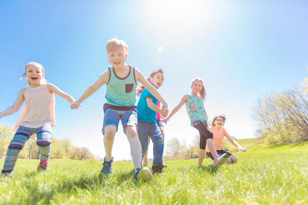 istock Group of child have fun on a field 850911302