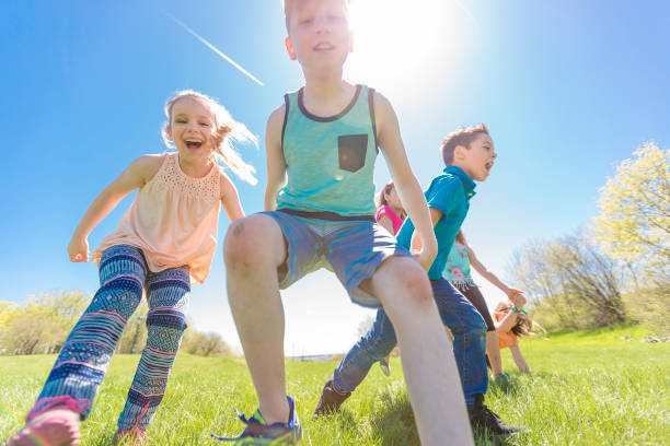 istock Group of child have fun on a field 850911422