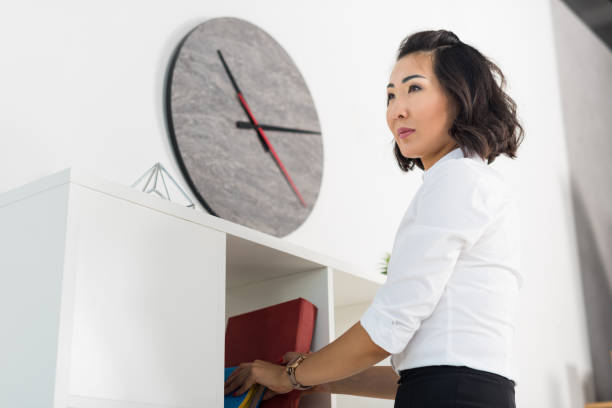 istock asian businesswoman with book 850911692